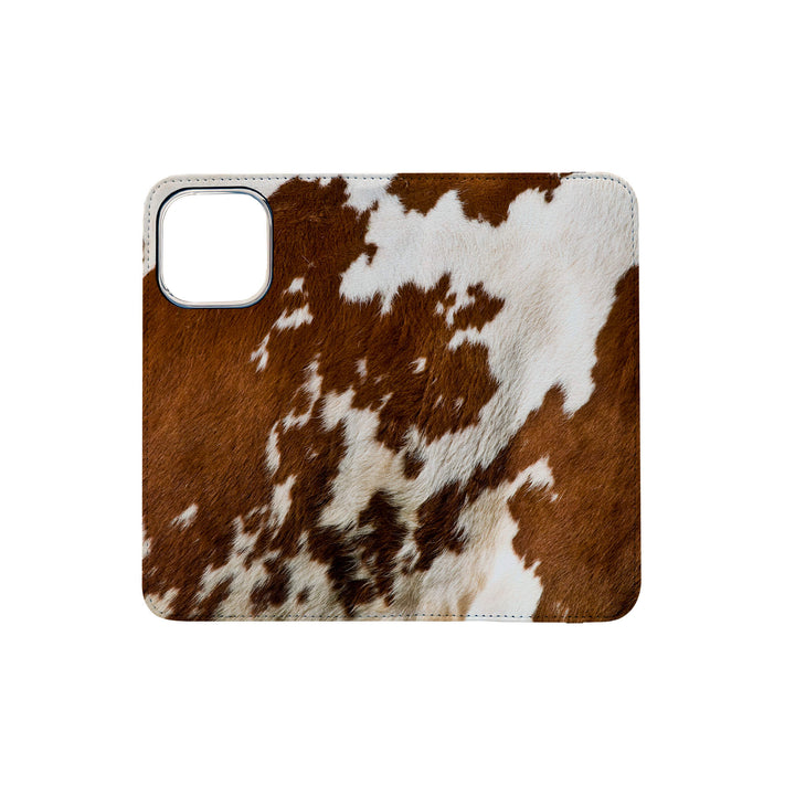 A cow print design, showcasing its unique pattern on this folio case.
