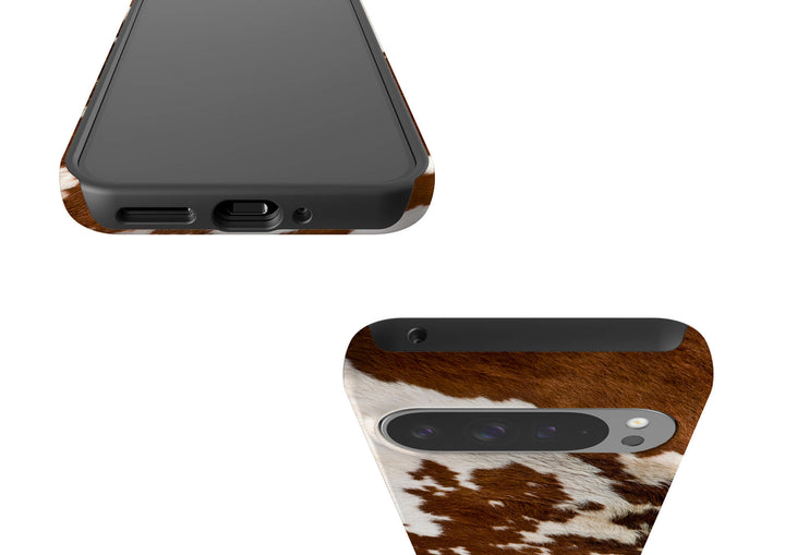A stylish Google Tough Phone case adorned with a classic cow print pattern, perfect for animal print enthusiasts.