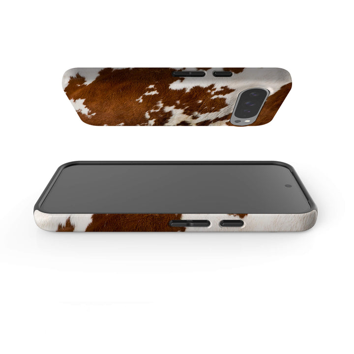 A stylish Google Tough Phone case adorned with a classic cow print pattern, perfect for animal print enthusiasts.
