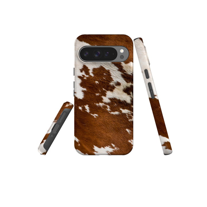 A stylish Google Tough Phone case adorned with a classic cow print pattern, perfect for animal print enthusiasts.
