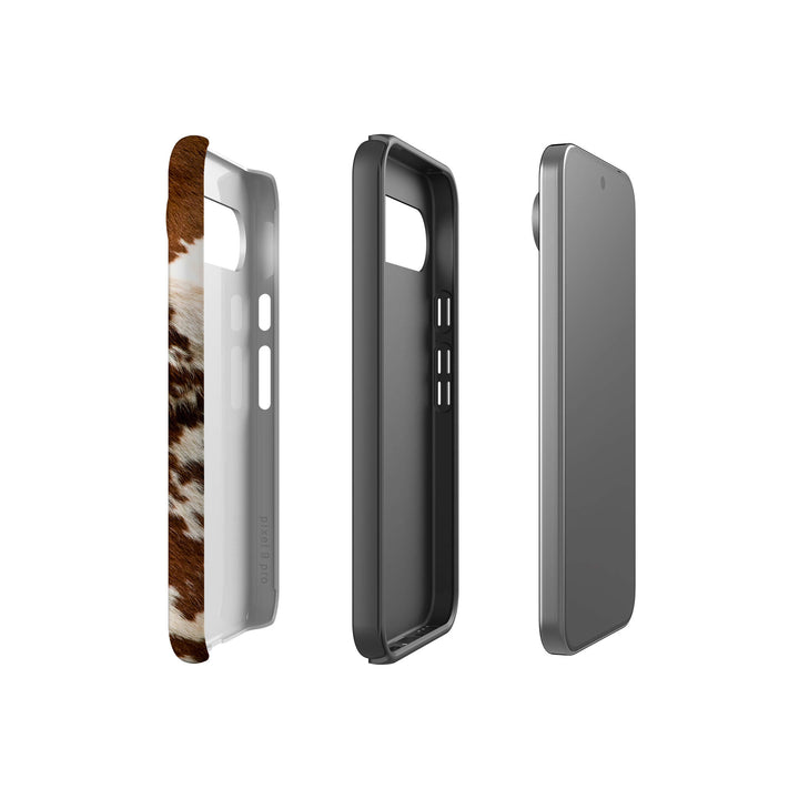 A stylish Google Tough Phone case adorned with a classic cow print pattern, perfect for animal print enthusiasts.