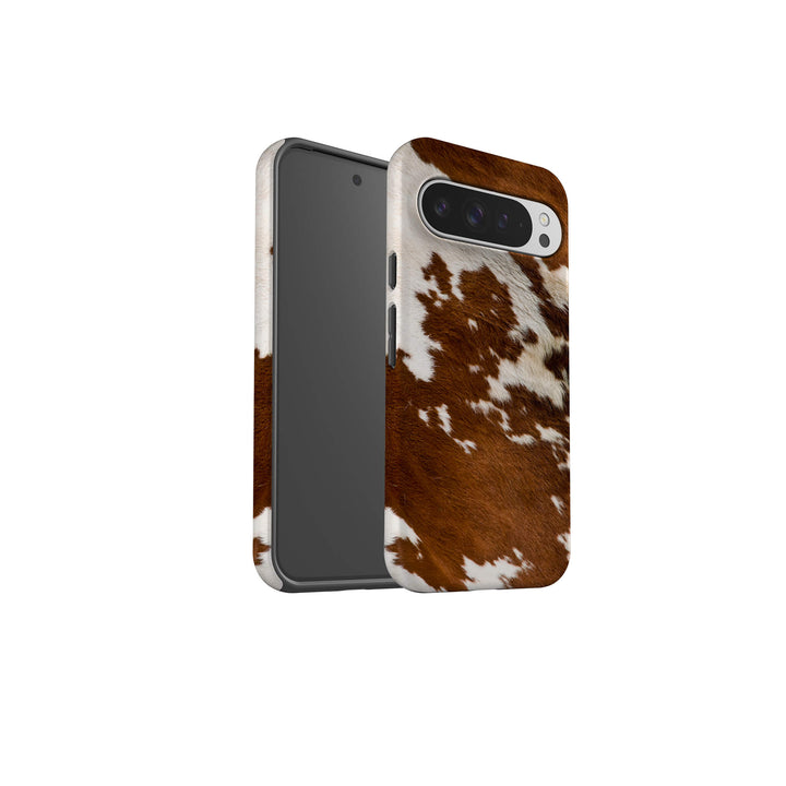 A stylish Google Tough Phone case adorned with a classic cow print pattern, perfect for animal print enthusiasts.