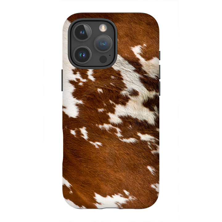 A stylish iPhone Magsafe Tough case with a brown and white cow print, perfect for those seeking a fun and unique accessory.