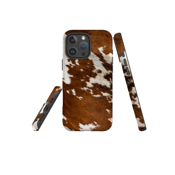 A stylish iPhone Magsafe Tough case with a brown and white cow print, perfect for those seeking a fun and unique accessory.