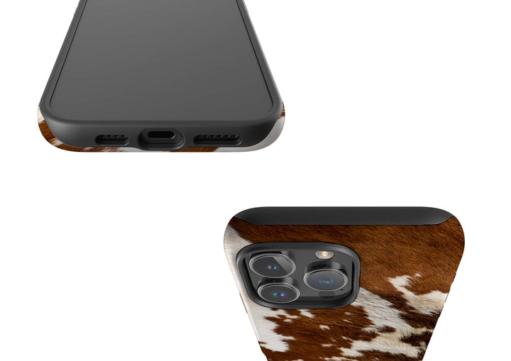 A brown and white cow print case designed for the iPhone, showcasing a unique and stylish pattern.