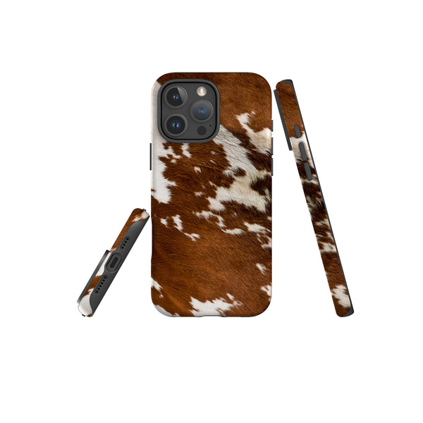 A brown and white cow print tough case designed for the iPhone, showcasing a unique and stylish pattern.